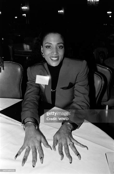 Florence Griffith Joyner Displays Her Fingernails During An Event At