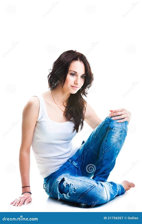 Pretty Woman In Blue Jeans Sitting On White Floor Stock Image Image