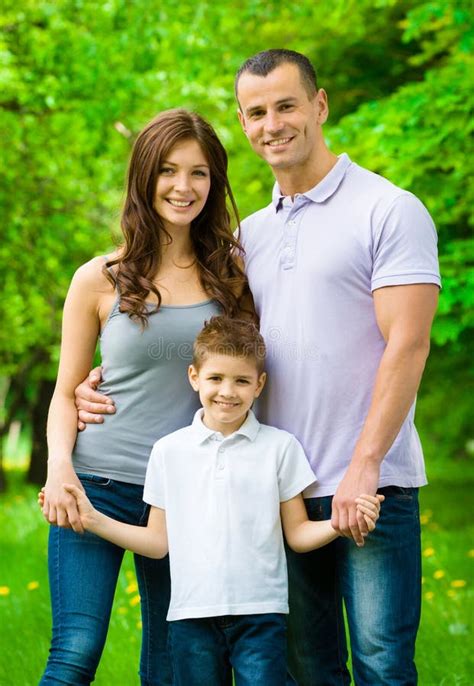 Portrait of Happy Family of Three Stock Photo - Image of color, brown ...