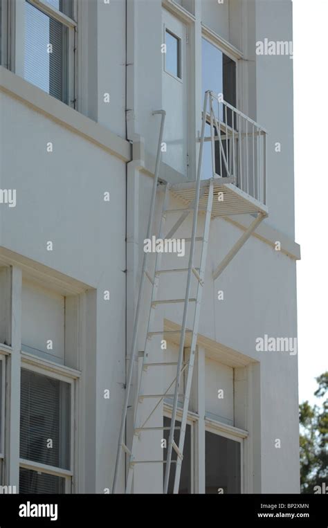 Emergency Exit Ladder And Stairs Painted White To Match The Side Of A