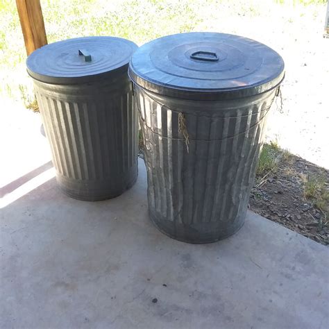 Lot Detail - 2 METAL GARBAGE CANS WITH LIDS