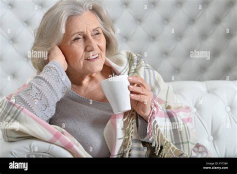 Mature Woman Drinking Tea Stock Photo Alamy