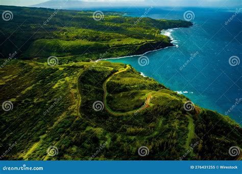 Aerial View Of An Idyllic Tropical Island Showcasing Lush Green Fields