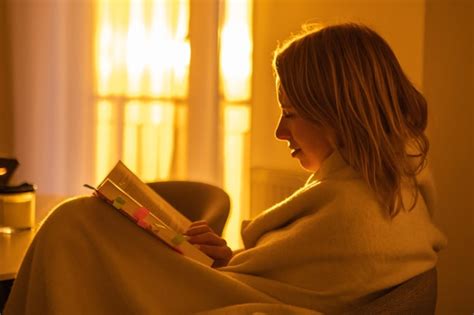 Premium Photo Smiling Young Beautiful Woman Reading A Book While