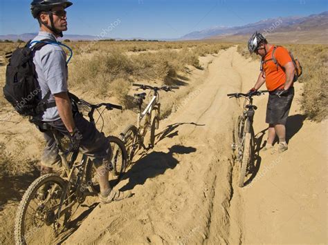 Two Men Mountain Biking — Stock Photo © Gregepperson 6410532