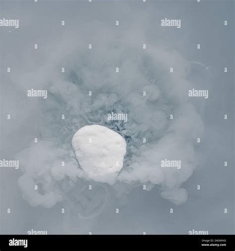 Sublimating dry ice - solid carbon dioxide Stock Photo - Alamy