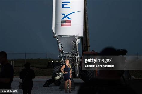 A Woman Poses For A Photo Before Spacex Ceo Elon Musks Presentation