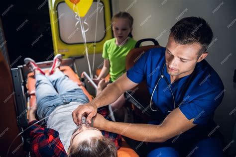 Premium Photo Young Man In A Medical Uniform Holding An Oxygen Mask