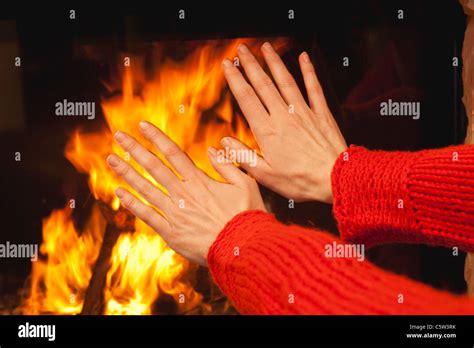 Person Warming His Hands At Open Fire Close Up Stock Photo Alamy