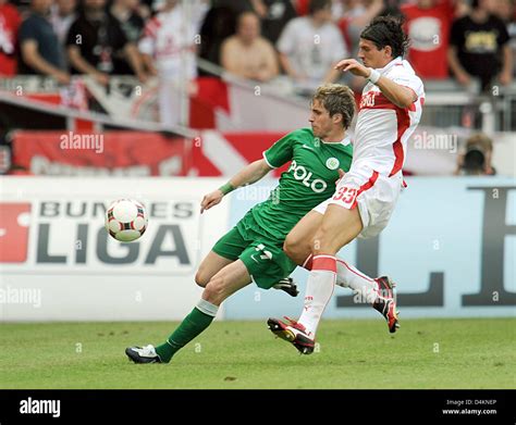 Stuttgart S Mario Gomez R And Wolfsburg S Peter Pekarik L Vie For