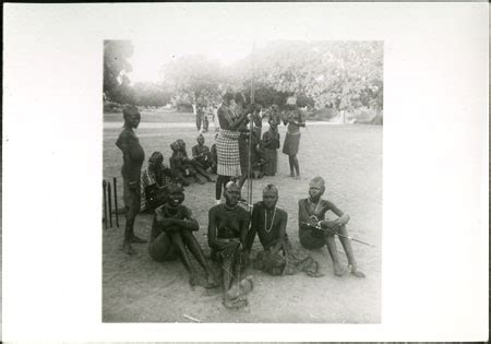 Mandari Women Sitting In Homestead From The Southern