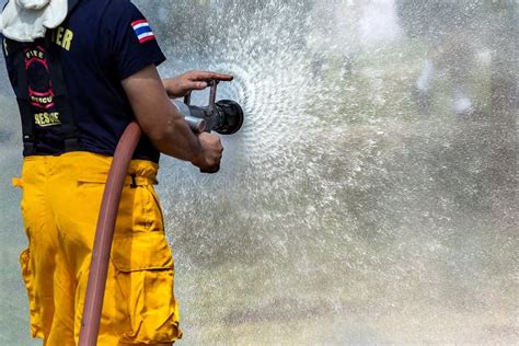 Fireman Using Water And Extinguisherfireman Using Water And