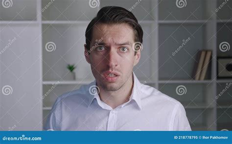 Shocked Male Businessman In White Shirt Takes Off Glasses And Say What