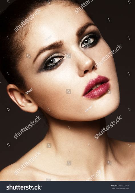 Beautiful Face Of A Glamour Woman With Smoky Eyes Make Up Close Up