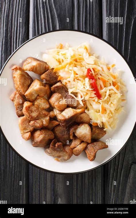 National dish of Haiti Griot or fried pork pieces, marinated in herbs and spices cooked and ...