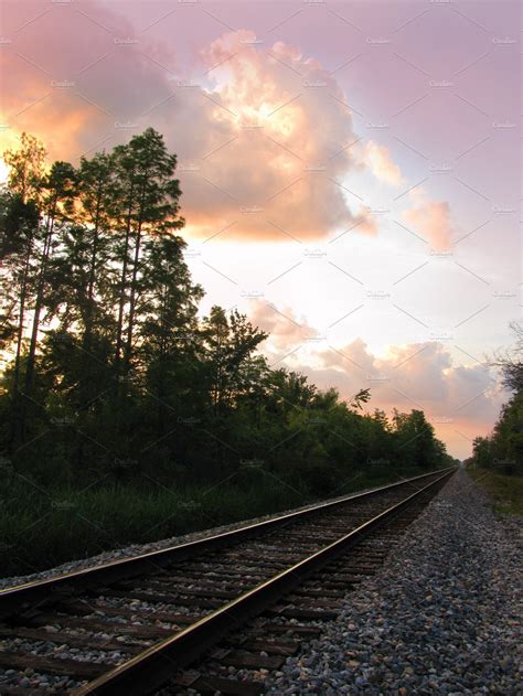 Railroad train tracks at sunset | Transportation Stock Photos ~ Creative Market