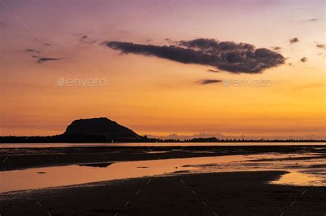 Scenic sunrise over Mount Maunganui in the North Island, New Zealand ...