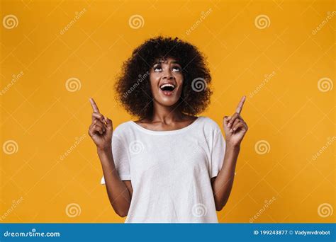 Image Of African American Girl Smiling And Pointing Fingers Upward Stock Image Image Of Woman