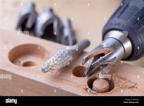 Drilling Holes In The Carpentry Workshop With A Special Drill Joinery