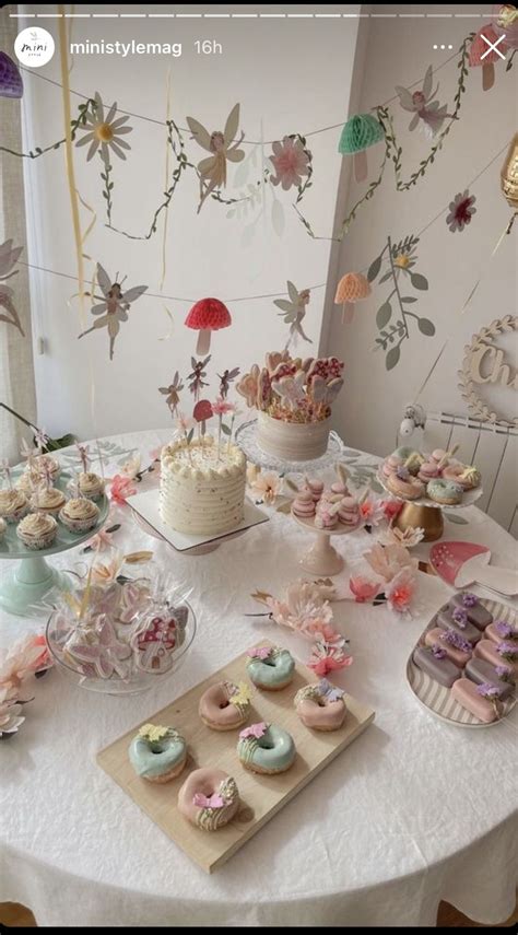 A Table Topped With Lots Of Cakes And Cupcakes