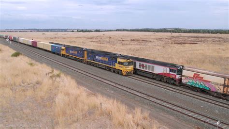 Pacific National 3ma5 Container Train Crosses Sct 3am9 Mixed Freight