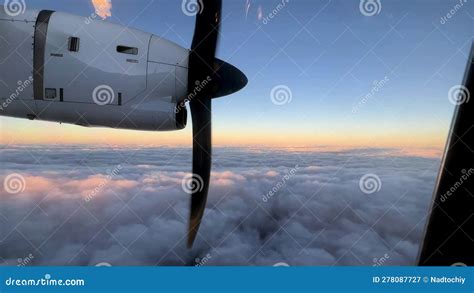 Rotating Propeller Of A Passenger Plane Flying Above The Clouds In The Sunset Sky Stock Video