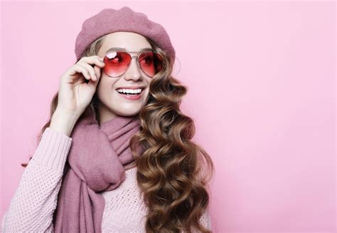 Premium Photo Beautiful Young Female Model With Long Wavy Hair Wearing Pink Beret And Scarf