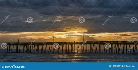 Nags Head Fishing Pier at Dawn Stock Photo - Image of dramatic, nags ...