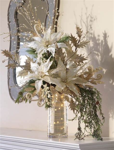 wow! LOVE these white poinsettias with gold and green accents. Very elegant christmas display ...