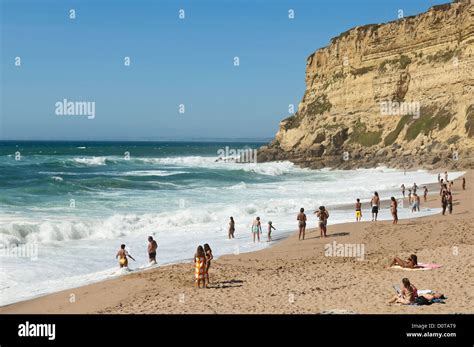 Portugal Beach Cliff Waves Bathers Sea Ocean Portugal Hi Res Stock