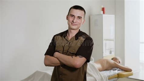 Portrait Of Masseur With Arms Crossed Standing In Spa Physical