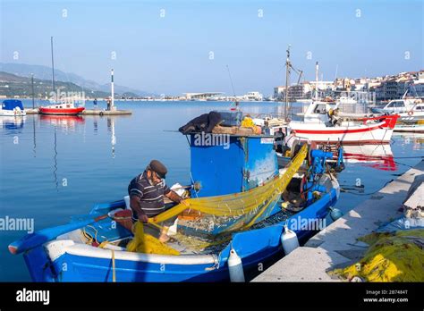 Fisherman Attending Nets Samos Town Samos Greece Stock Photo Alamy