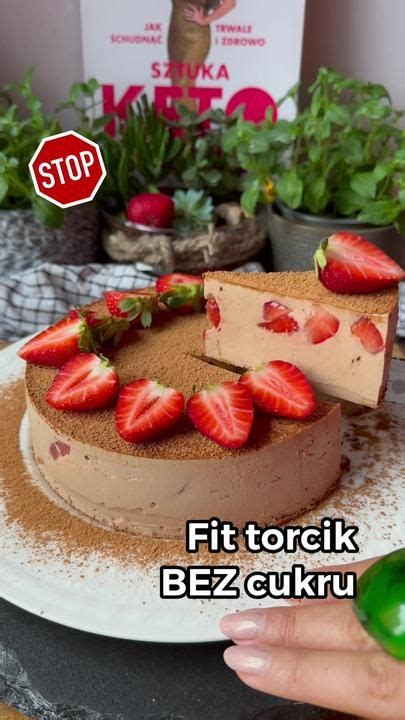 A Chocolate Cake With Strawberries On Top And A Stop Sign Above It That