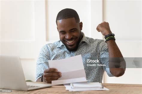 Happy African American Guy Received Banking Loan Approval Stock Photo