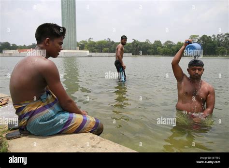 Dhaka Bangladesh Nd May On The Hot Summer Noon A Bangladeshi Man Takes Bathe In The