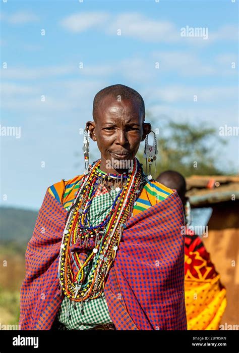 Portrait Of An Old Masai Tribe Woman In Traditional Clothes Close Up