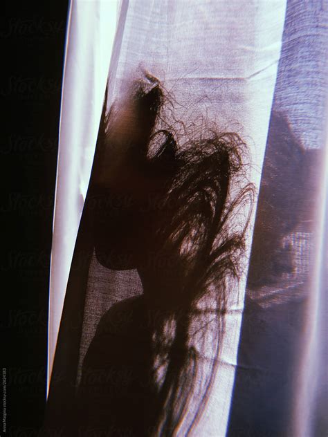 A Woman Hiding Behind A Curtain By Stocksy Contributor Anna Malgina