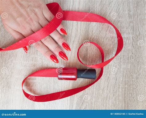 Female Hand With Red Long Nails And A Bottle Stock Image Image Of