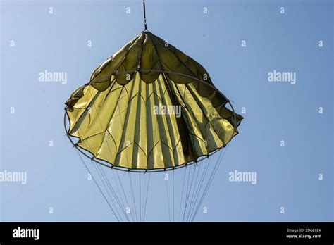 Parachuting Sport Concept Skydiver Descending With A Parachute Stock