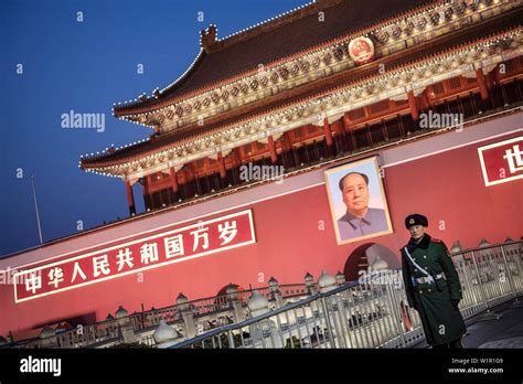 Policeman Or Guard In Front Of Portrait Of Mao Zedong At Tiananmen Gate