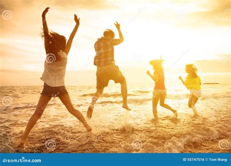 Happy Young People Dancing On The Beach Stock Photo - Image: 55747516