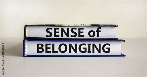 Sense of belonging symbol. Books with words 'sense of belonging' on beautiful white background ...