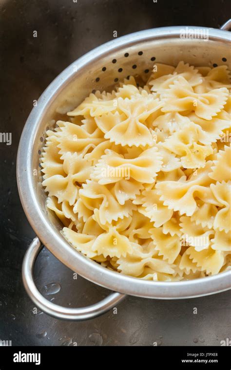 Cooked Farfalle Bow Tie Pasta In A Colander Stock Photo Alamy