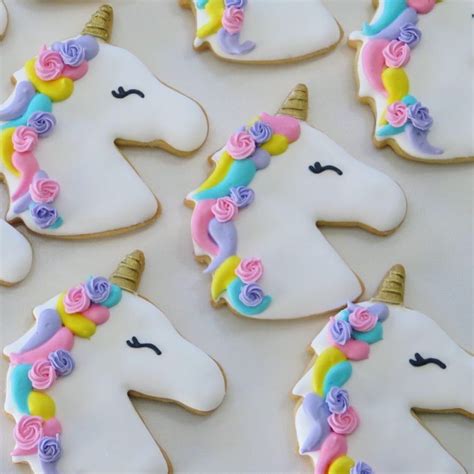 Decorated Cookies In The Shape Of Unicorns With Flowers