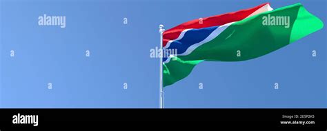 3D Rendering Of The National Flag Of Gambia Waving In The Wind Against