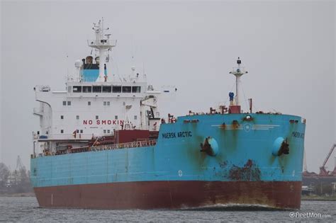 A Large Blue And Brown Ship In The Water