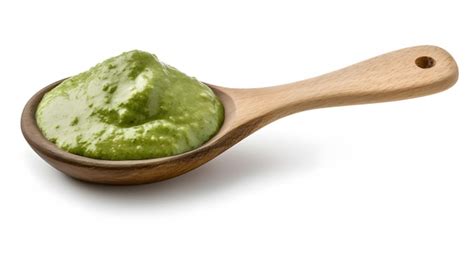 Premium AI Image Green Mojo Sauce Mojo Verde Spilled In Wooden Spoon