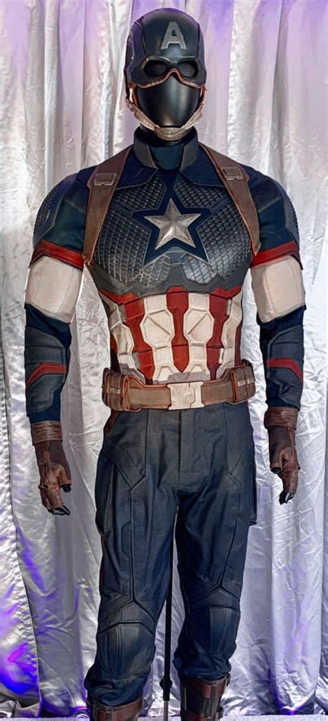 A Captain America Costume On Display In Front Of A Curtain