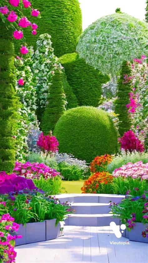 The Garden Is Full Of Colorful Flowers And Plants