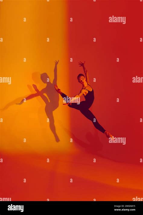 Elegant Motion In Neon Graceful Dancer Poses In Black Sports Overalls